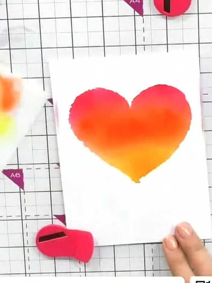 Step 4: Add yellow ink to the lower portion of the heart using the blending brush to complete the ombré effect, blendi