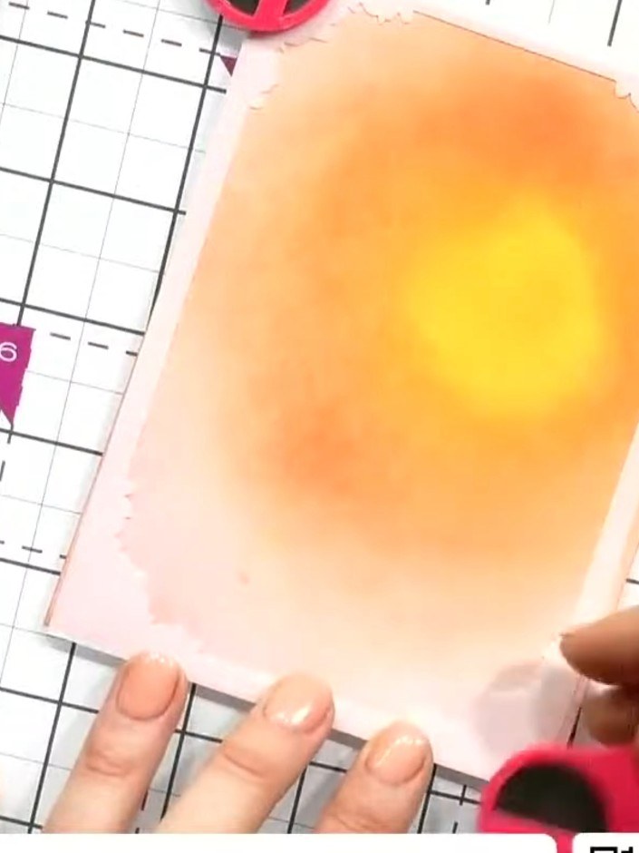 Step 2: Apply a darker orange or yellow ink around the edges of your sunset panel using a blending brush. Work the ink