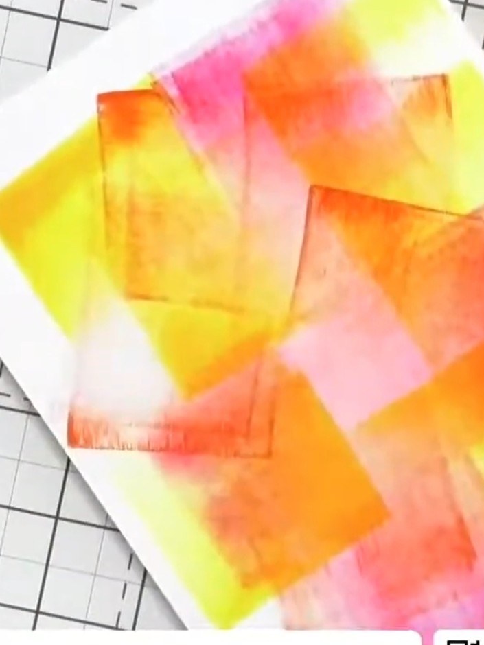 Step 3: Position your hand or a piece of card over the section of the colourful swiped background that you want to kee