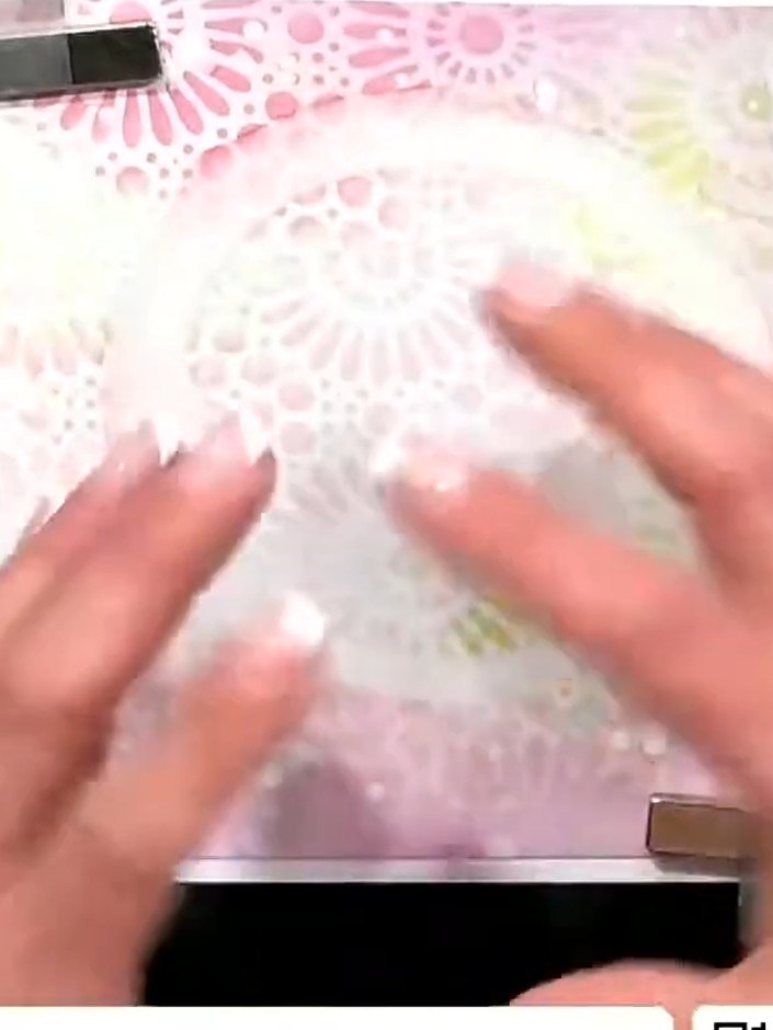 Step 1: Create a watercolour background by placing water around the lid of your palette or container. Add colour on to