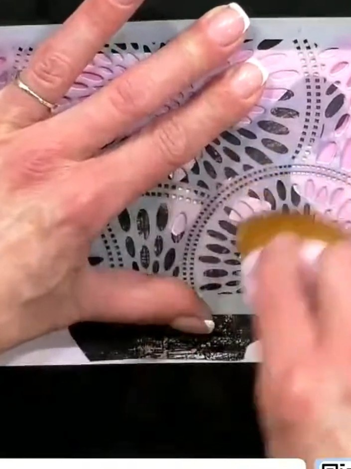 Step 3: Apply ink to a brush and use it through the stencil mask to create a soft, coloured background around where th