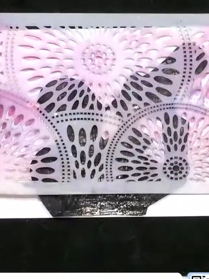 Step 4: Carefully peel away the pink stencil mask from the stamped image to reveal the white areas beneath. Allow the 