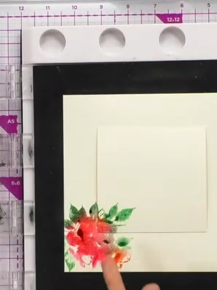 Step 4: Rotate the watercolour card and stamp the floral image in different positions around the edges and corners usi