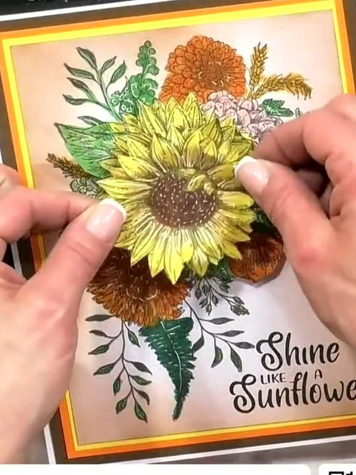 Step 10: Stamp the sentiment 'Shine like a Sunflower' onto the lower right area of the card. Layer the 3D decoupage sun