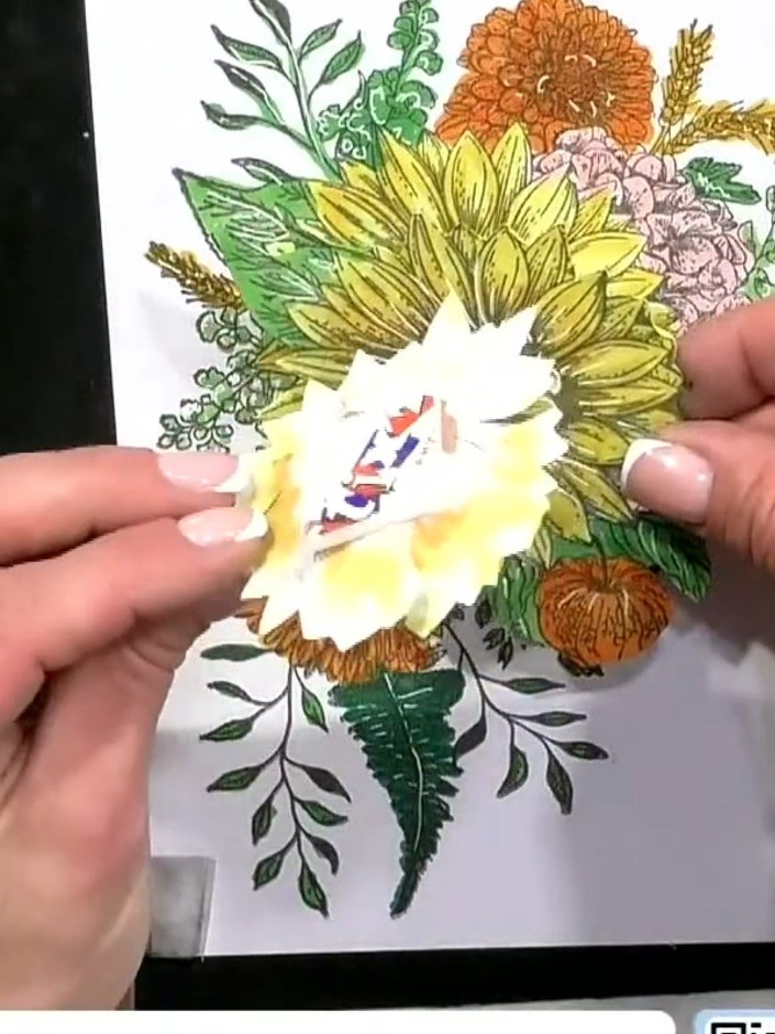 Step 2: Colour the first layer of the sunflower petals lightly with yellow alcohol markers. Work gently to create a so