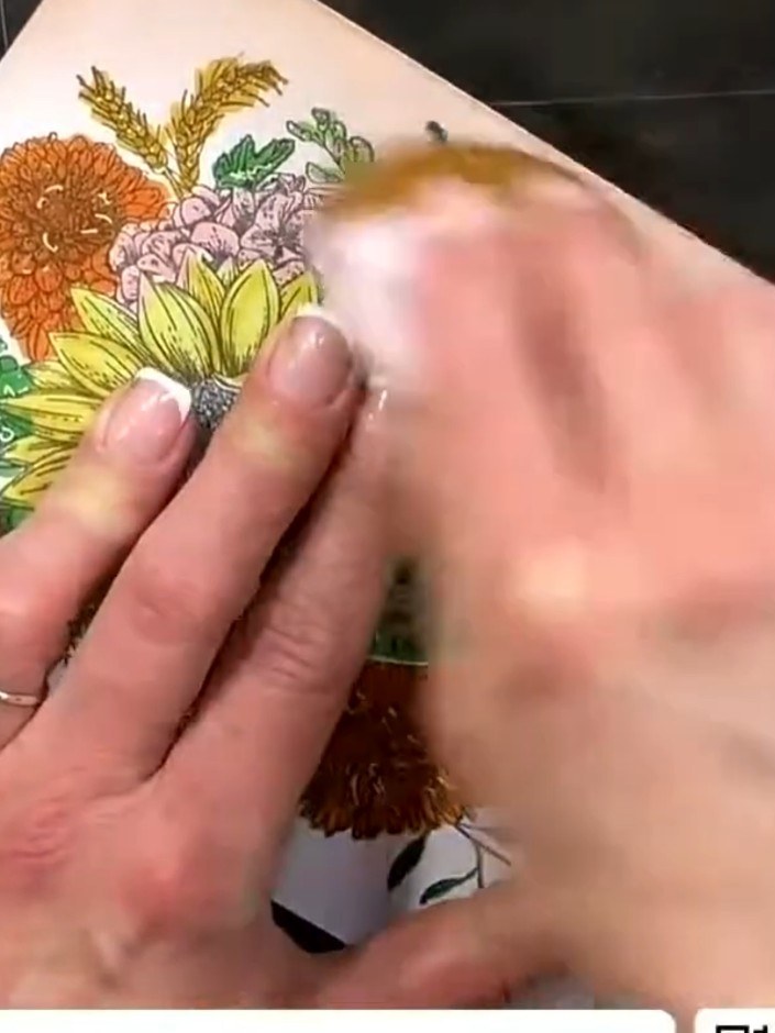 Step 3: Colour the second layer of petals more heavily using your chosen ink colours. Add depth and shading to create 