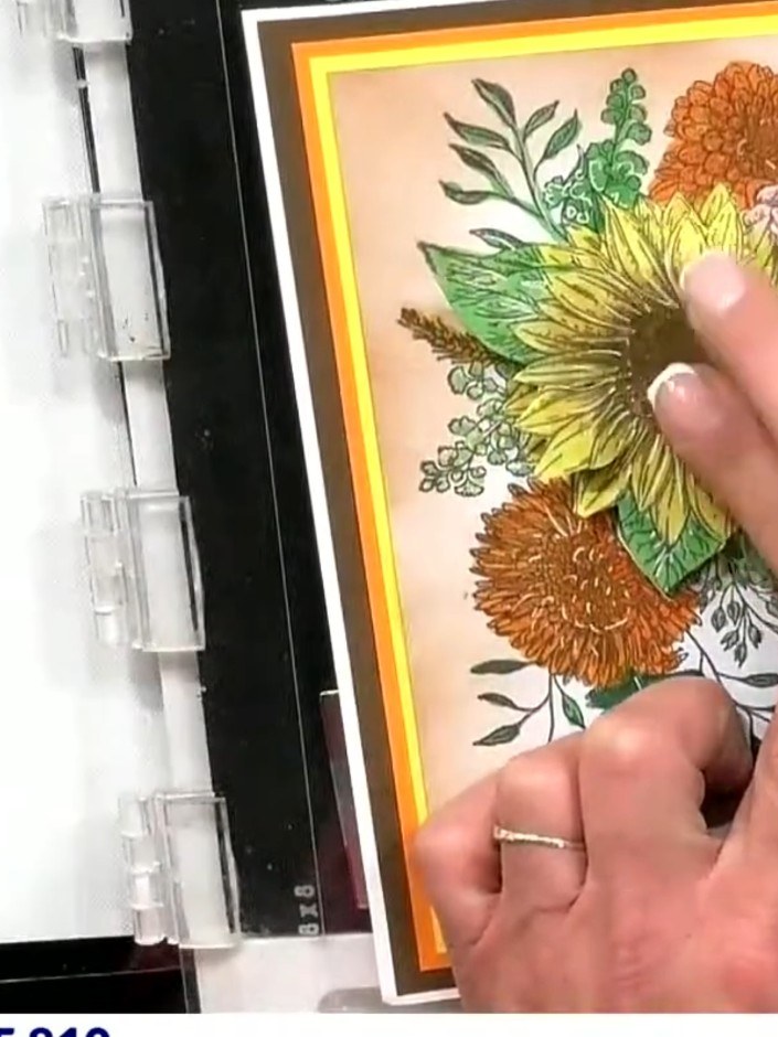 Step 7: Attach the second layer of cut sunflower petals on top of the first layer using foam dots. Position the petals