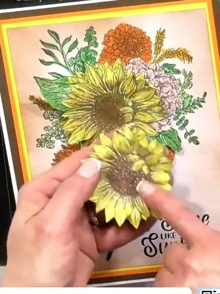 Step 9: Use a white gel pen to add highlights and texture to all visible petals on the sunflowers. Work on both the ma