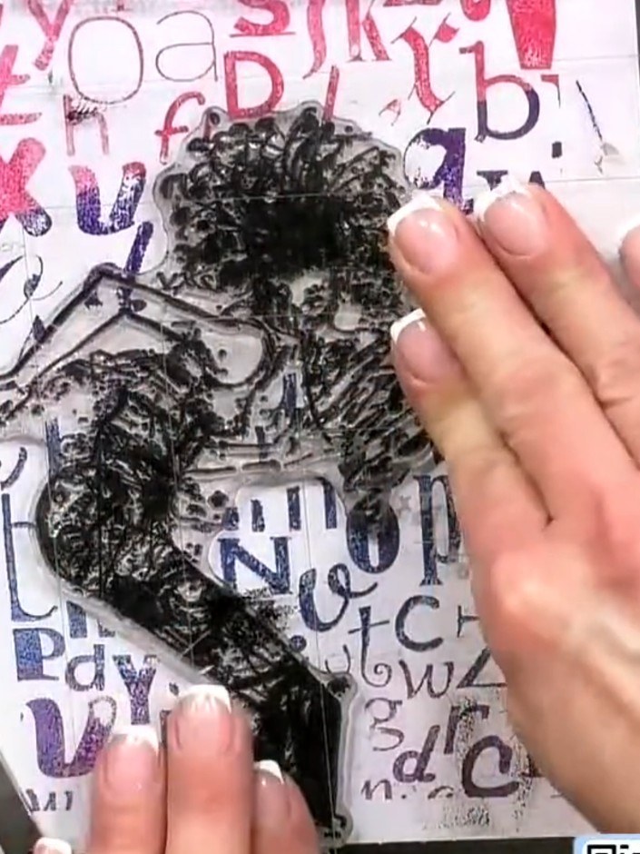 Step 6: Stamp the character image in black ink directly over the ombre background, positioning it centrally over the m