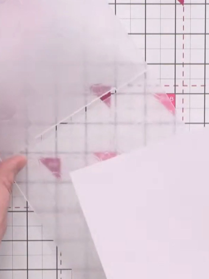 Step 2: Place the love hearts embossing folder in your die-cutting machine, positioning it on the white card panel to 