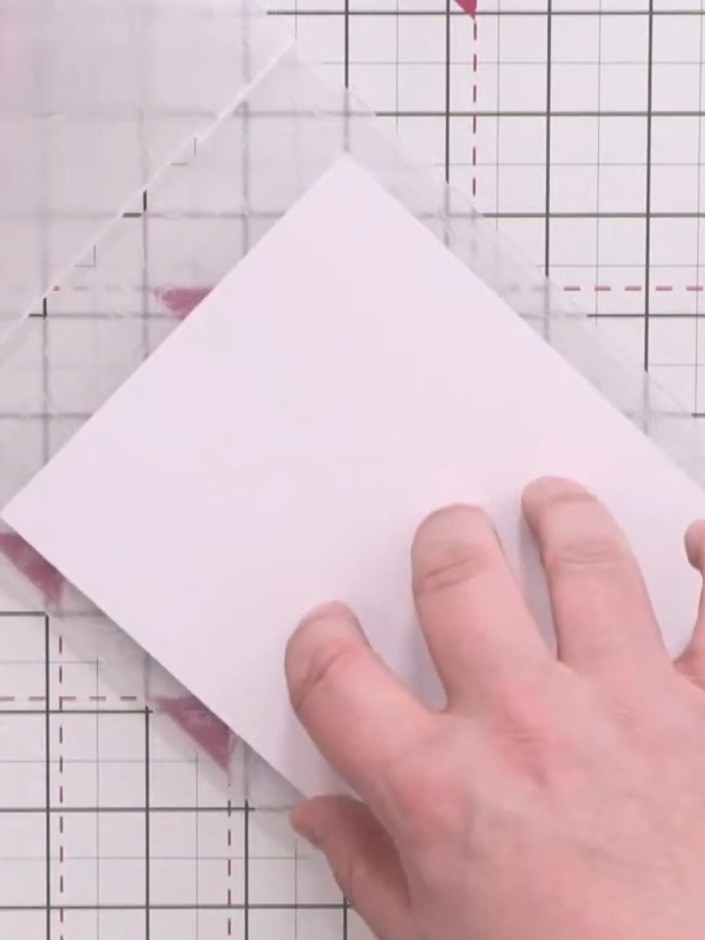 Step 3: Place your white card square into the Love Hearts embossing folder. Run the folder through your embossing mach
