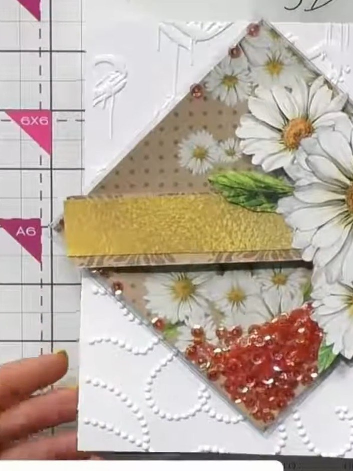 Step 6: Mount the completed embossed card onto a card base. Hide the join line between the two embossed designs by pla