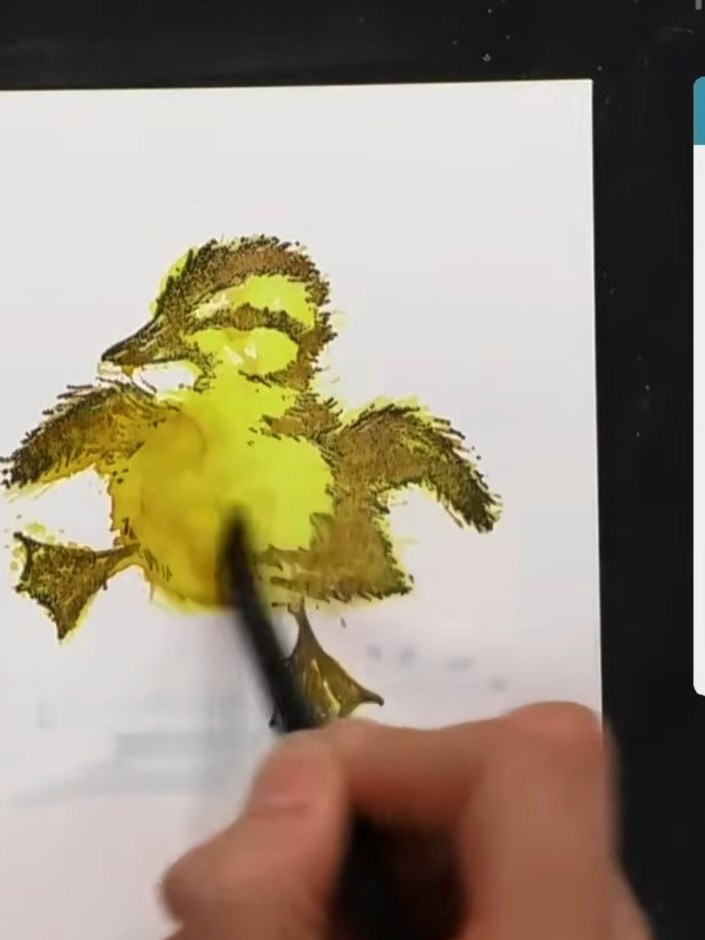 Step 13: Use a wet brush with water to blend out any unwanted splodges or marks on the yellow watercolour areas of the 
