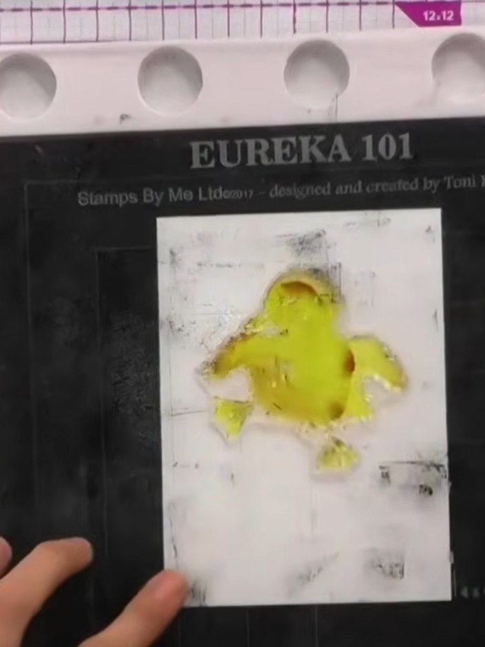 Step 5: Lightly spray the inked stamp with water to activate the watercolour effect and create a soft, blended appeara