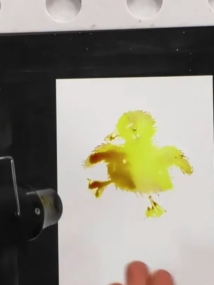 Step 6: Stamp the duckling design firmly onto the watercolour card. Lift the stamp away cleanly to reveal the watercol