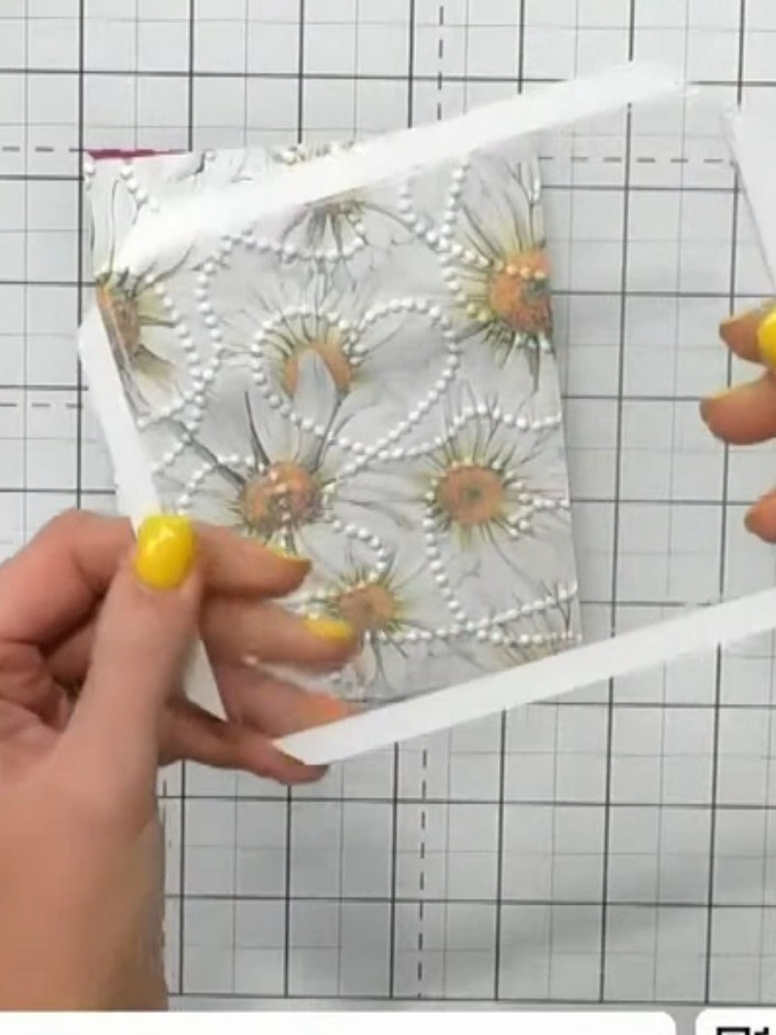 Step 1: Remove the Infinity Shaker card window from its packet. Examine the scored lines and the pre-applied tape on t