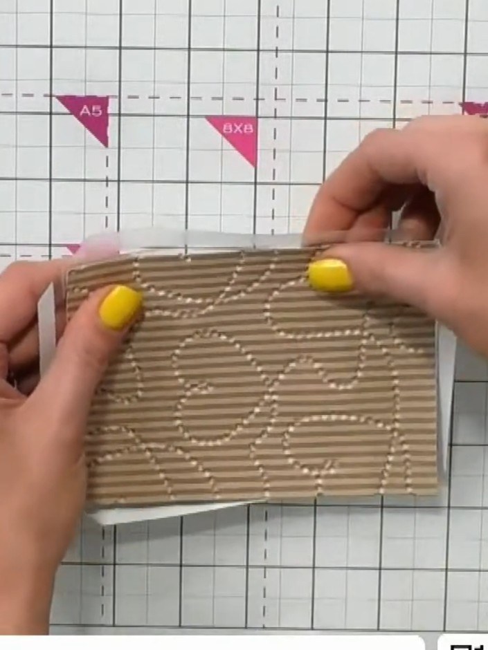 Step 5: Place the textured cardstock inside the shaker window, positioning it face down. Smooth it into place to ensur