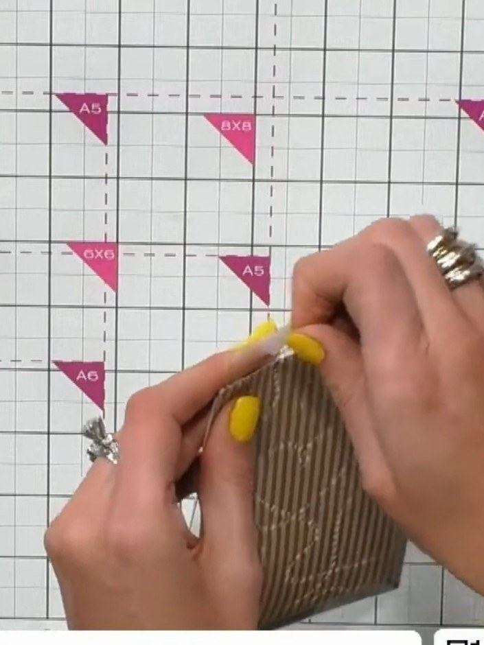 Step 7: Deja abierto uno de los lados largos de la ventana de acetato como bolsillo para agregar los adornos más adelante.