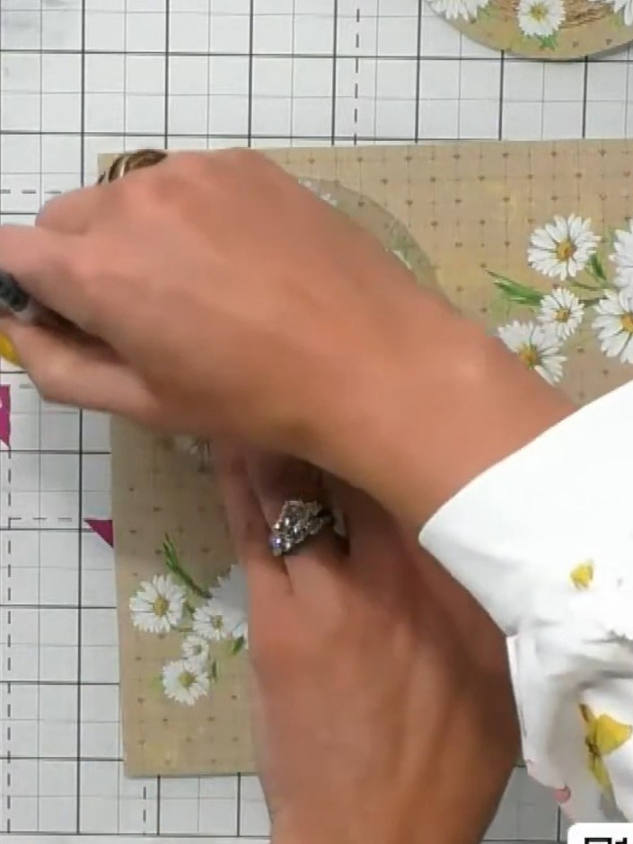 Step 3: Using scissors, carefully cut out the circle from the acetate window, cutting just inside the pencil line to e