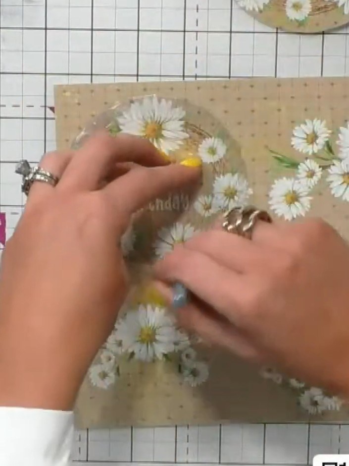 Step 5: Apply red liner tape or similar adhesive around the back edge of the circle acetate window. Work carefully aro