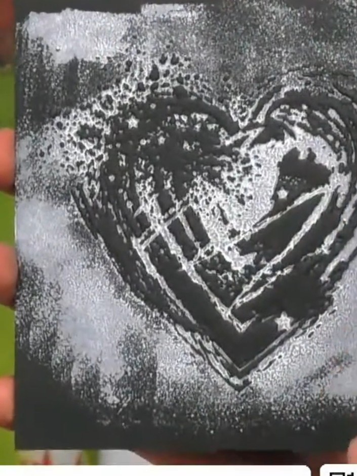 Step 7: Mount the embossed black cardstock heart design onto a white or cream card base. Alternatively, display it in 