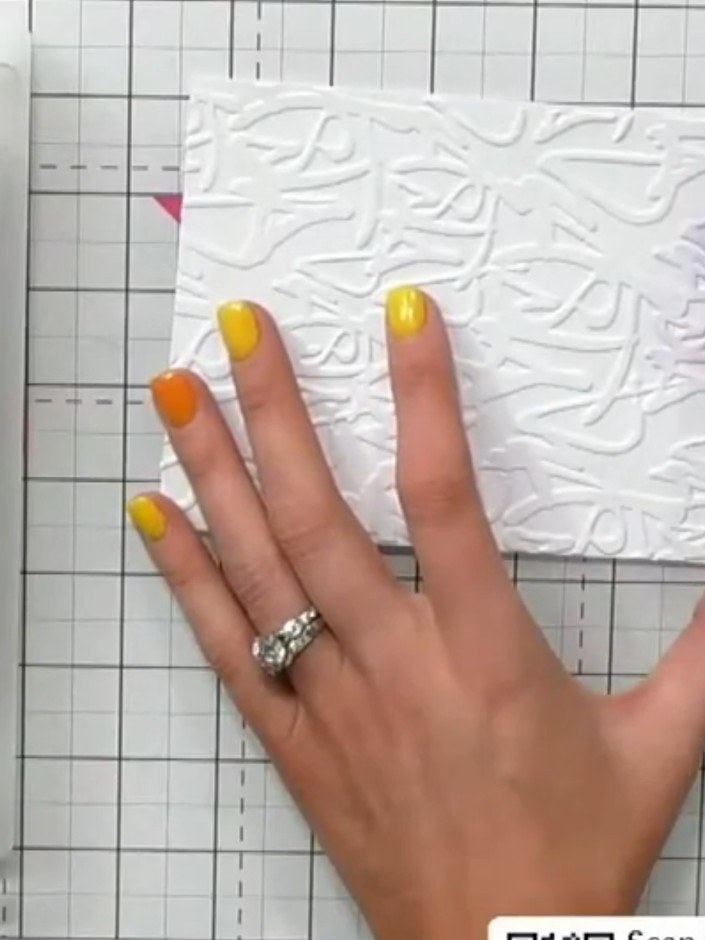 Step 3: Remove the embossed cardstock from the embossing folder and set it aside. The graffiti-style texture should no
