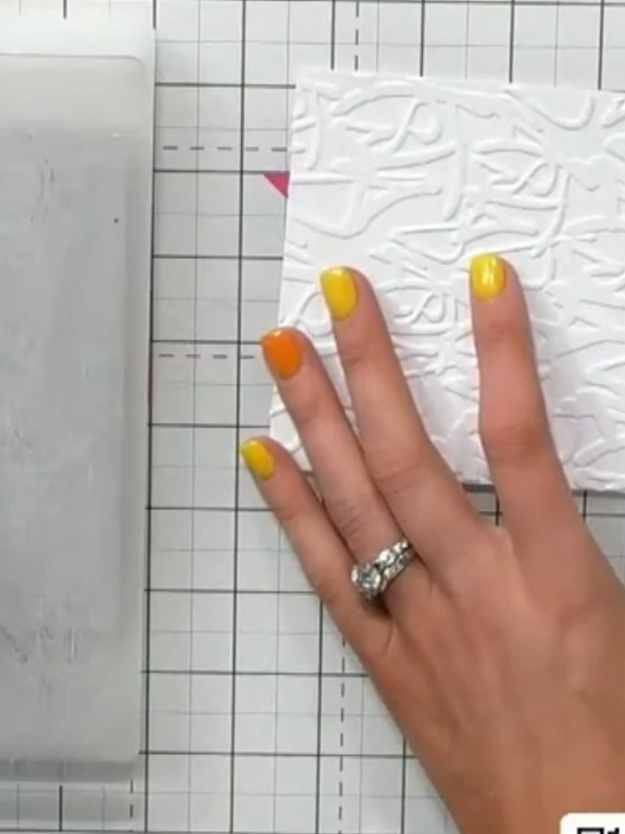 Step 5: Swipe the coloured ink across the embossed surface using artistic strokes. Hold the embossed panel steady with