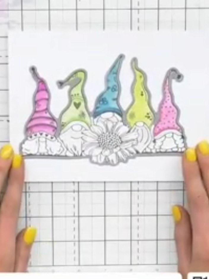Step 2: Score one of the white card pieces along the fold line to create the card base. Use a scoring tool to create a