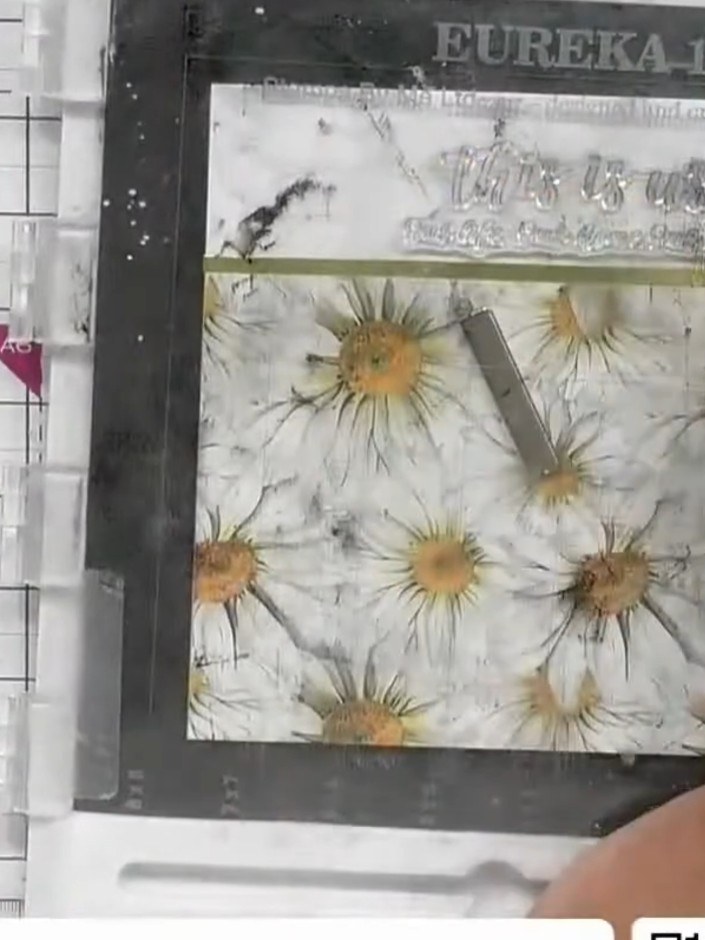 Step 3: Add an offcut of the daisy patterned paper to the top edge of the card front, creating a cohesive border desig