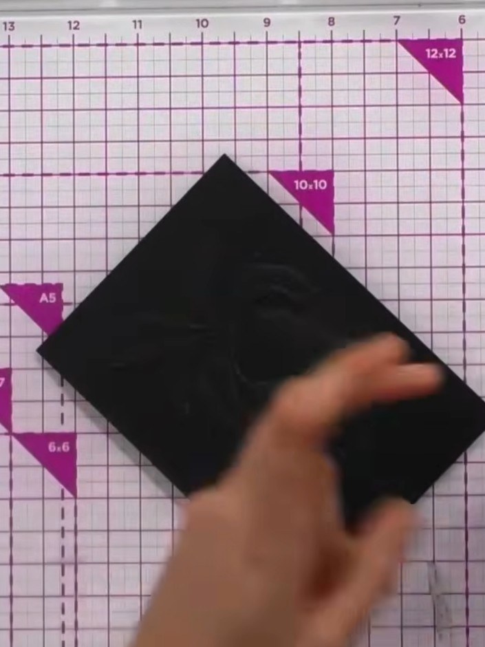 Step 3: Apply gold wax generously onto the embossed black card surface using your finger or an applicator. Rub the wax