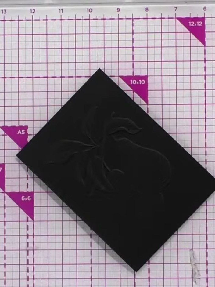 Step 5: Tilt the finished card to view the embossed effect and see how the gold wax highlights the dimensional details