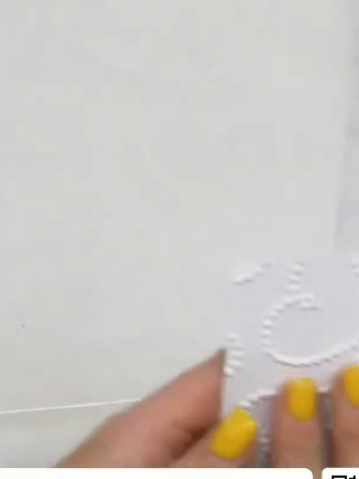 Step 2: Place your metallic or textured cardstock into the embossing folder, ensuring it is positioned centrally withi
