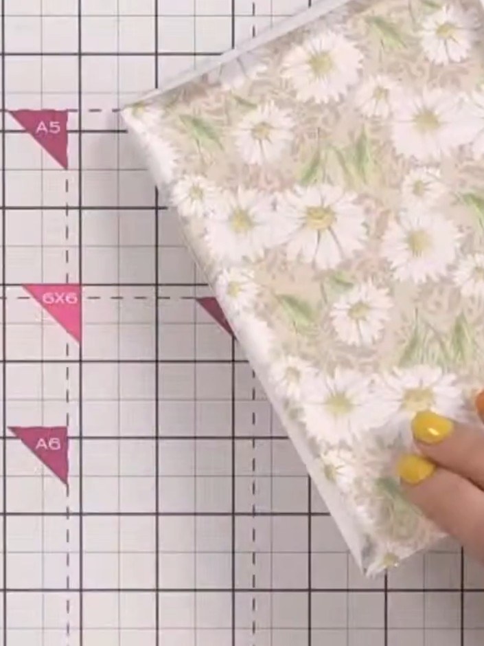 Step 2: Select a piece of patterned paper from the Sunshine In My Pocket pack and cut it to fit inside the acetate sha