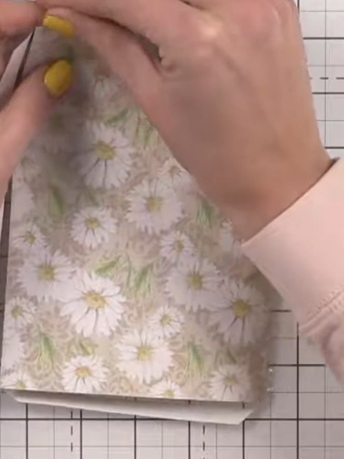 Step 7: Remove the tape backing from one side of the acetate window and carefully line it up inside the window square 