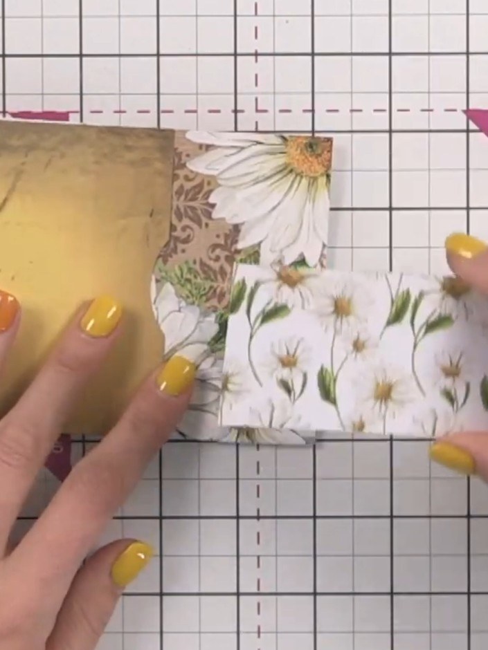 Step 12: Cut a strip from the leftover 6 by 8 inch patterned paper offcut. Wrap it around the closed album to create a 