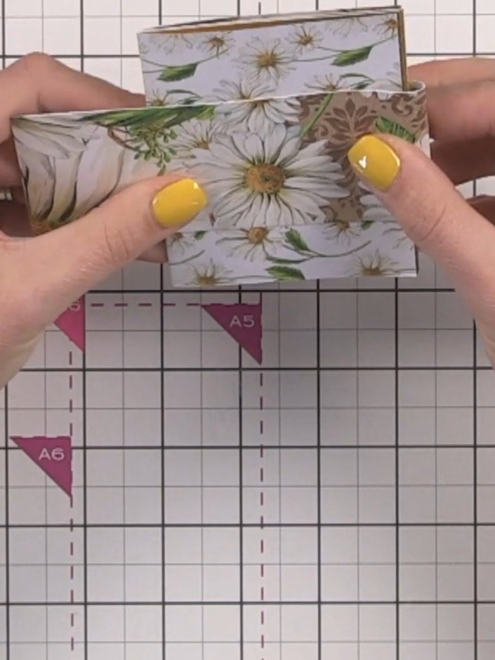 Step 13: Fussy cut floral elements from the patterned paper offcuts to use as decorative embellishments for the front c