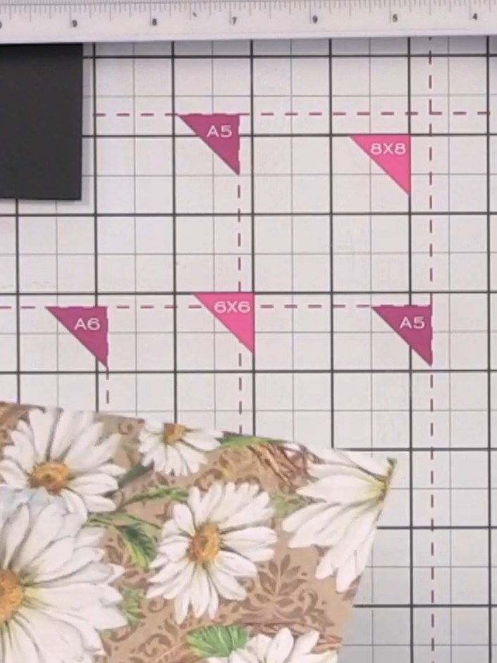 Step 2: Score the decorative paper at 4 inches in one direction, then rotate the paper 90 degrees and score at 3 inche