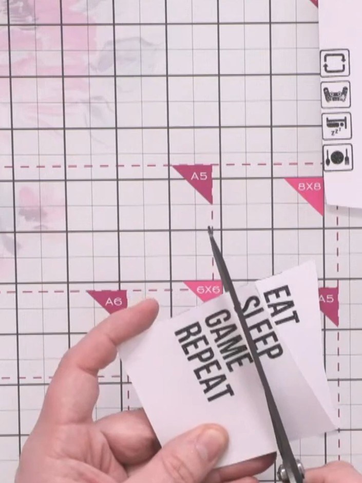 Step 12: Carefully cut out the stamped character and sentiment words using scissors. Take your time to cut neatly aroun