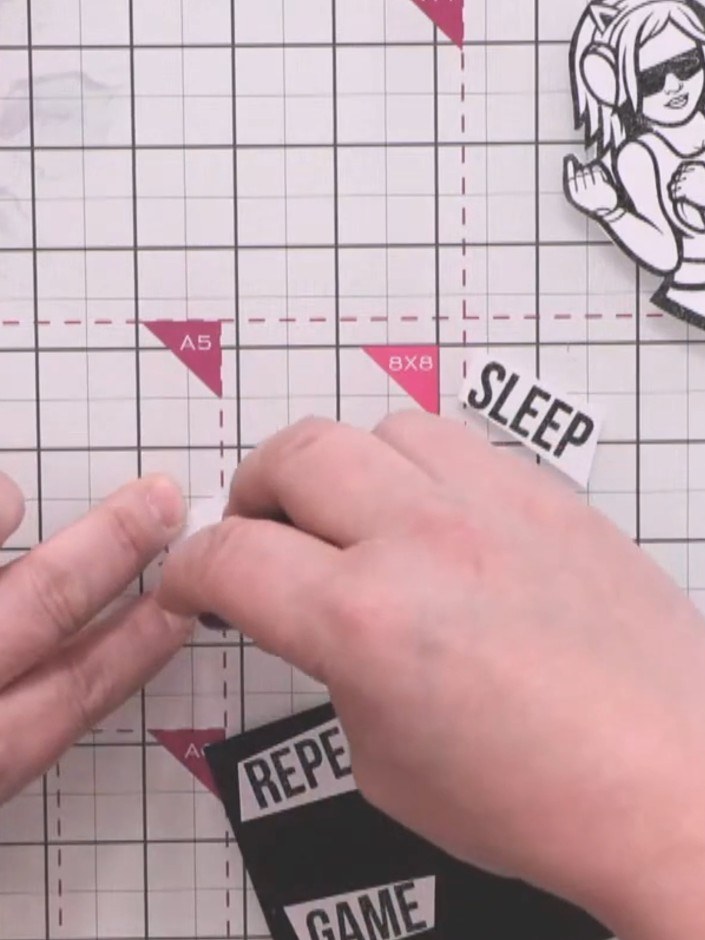 Step 13: Mount the character and sentiment pieces onto black cardstock to create borders. Carefully cut around each mou