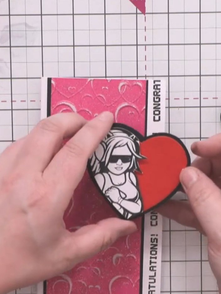 Step 14: Mount the smaller heart onto foam pads and attach it to the card front, creating a dimensional border effect a