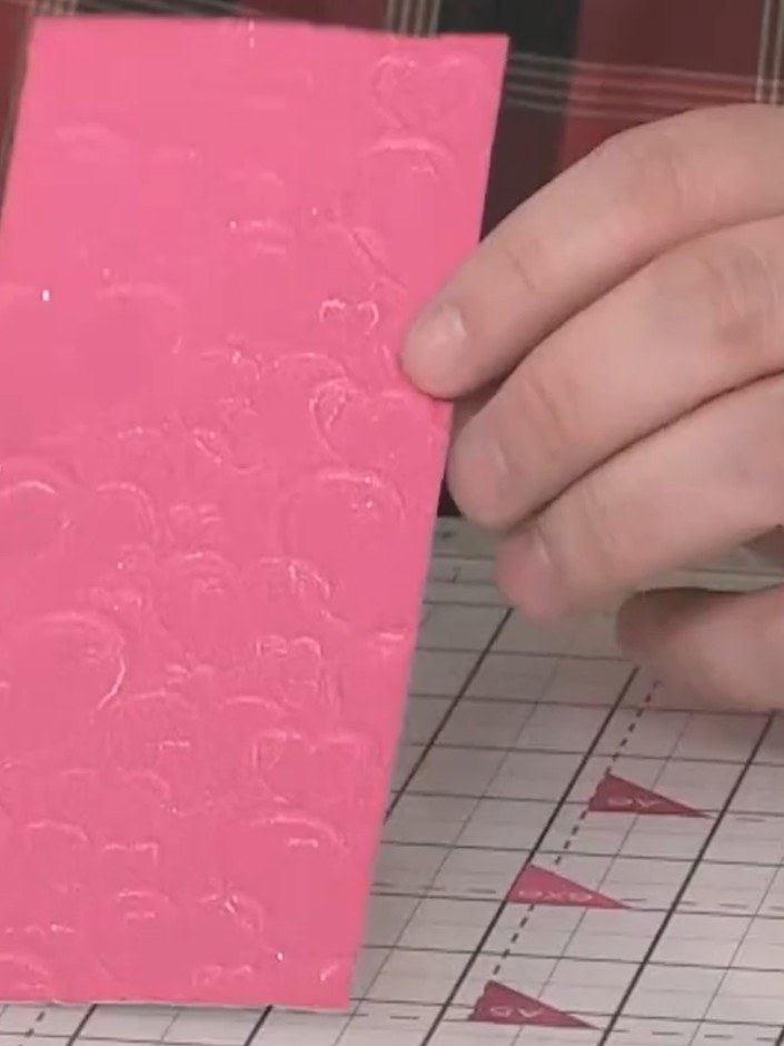 Step 4: Run the extended panel through the embossing machine again to emboss the additional section seamlessly with th