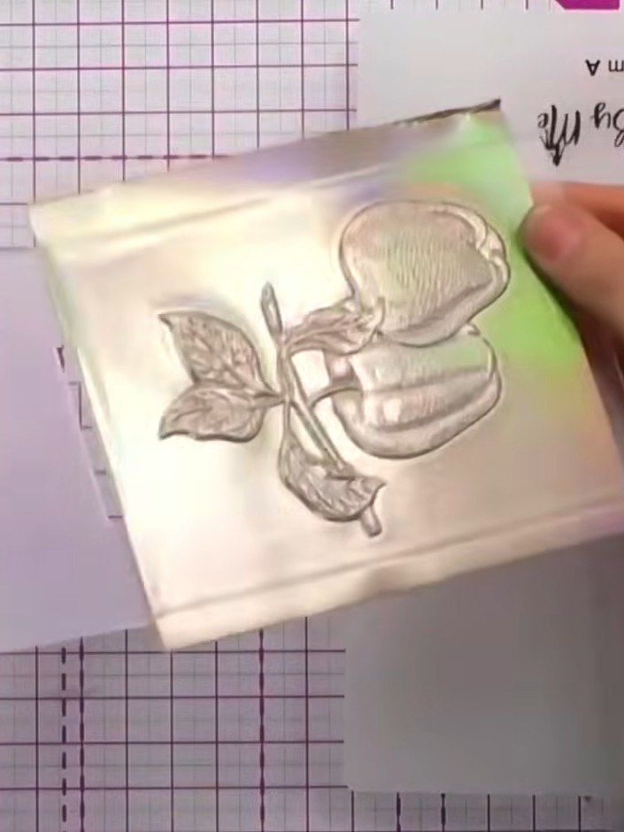 Step 5: Trim the embossed card down to your desired size using a trimmer or scissors. The card can now be mounted onto