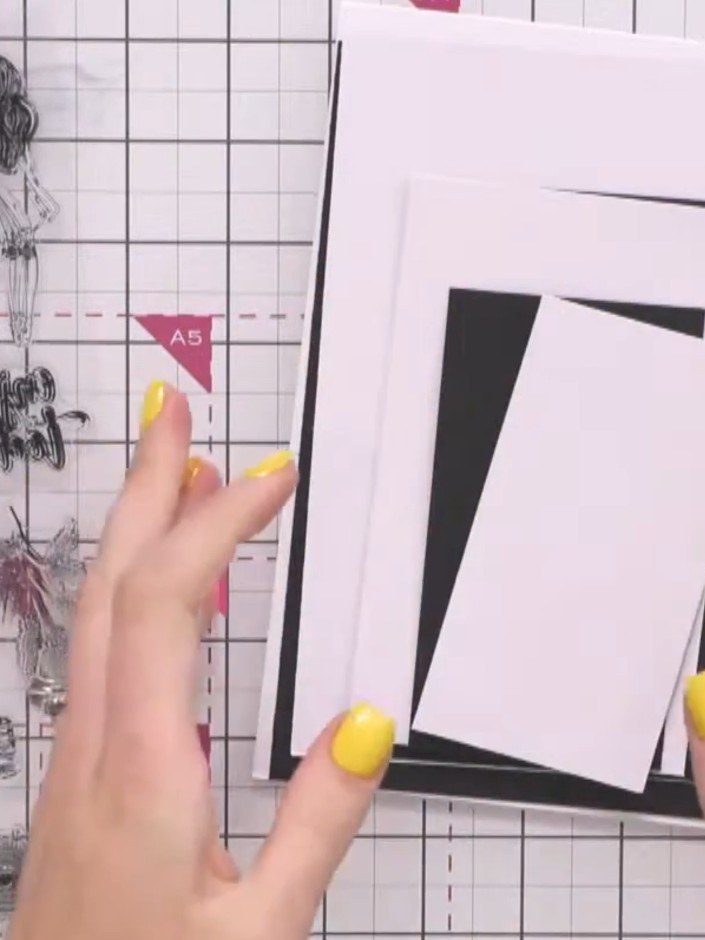 Step 1: Prepare three layers of white card. Secure the middle layer to the base layer using repositionable tape, allow