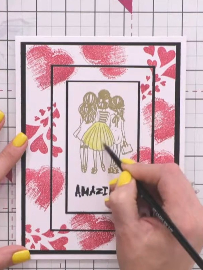 Step 10: Paint the girl's skirt using yellow embossing powder and a paintbrush to add shimmer and coordinate with the g