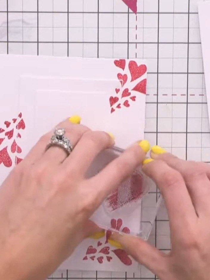 Step 3: Stamp the solid heart image onto the centre of the middle layer panel. Press down firmly to capture all the de