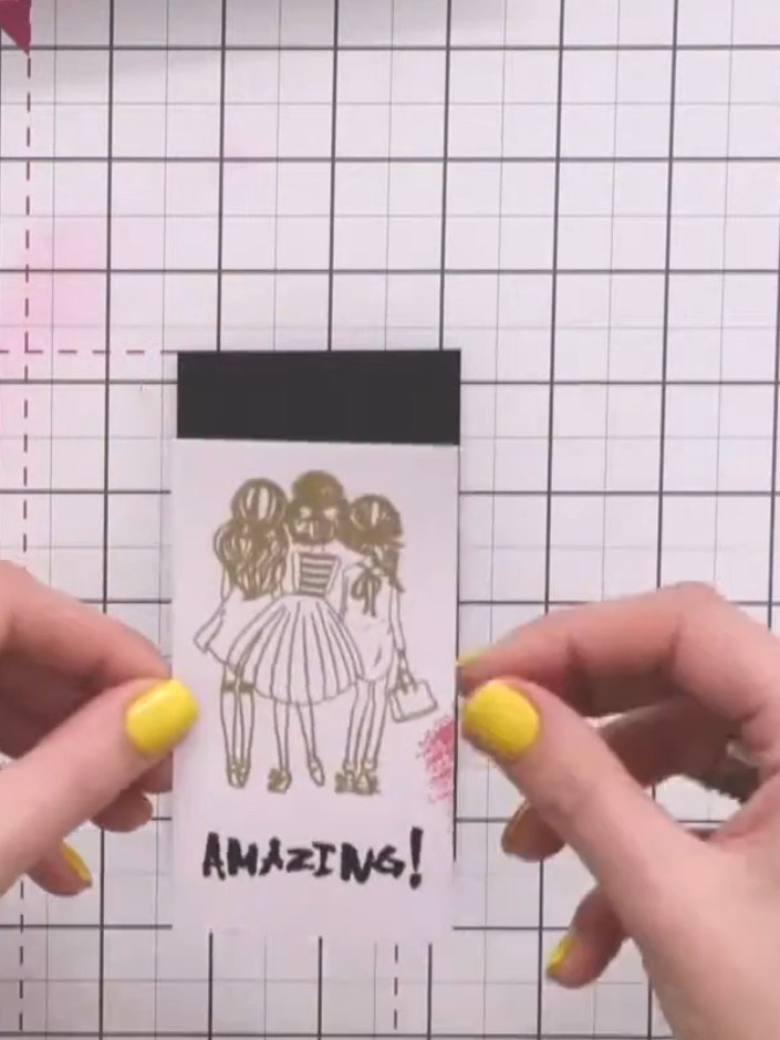 Step 8: Glue the middle layer with the stamped image onto a small piece of black card to create a mat. Then glue this 