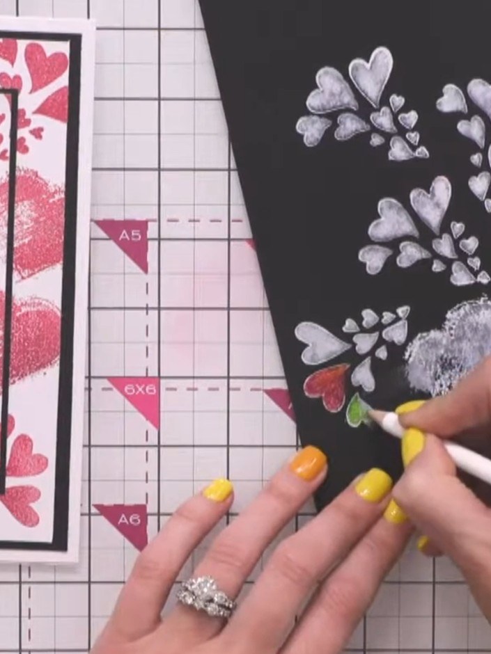 Step 4: Using coloured markers, carefully colour in selected areas of the white stamped hearts and branches, leaving a