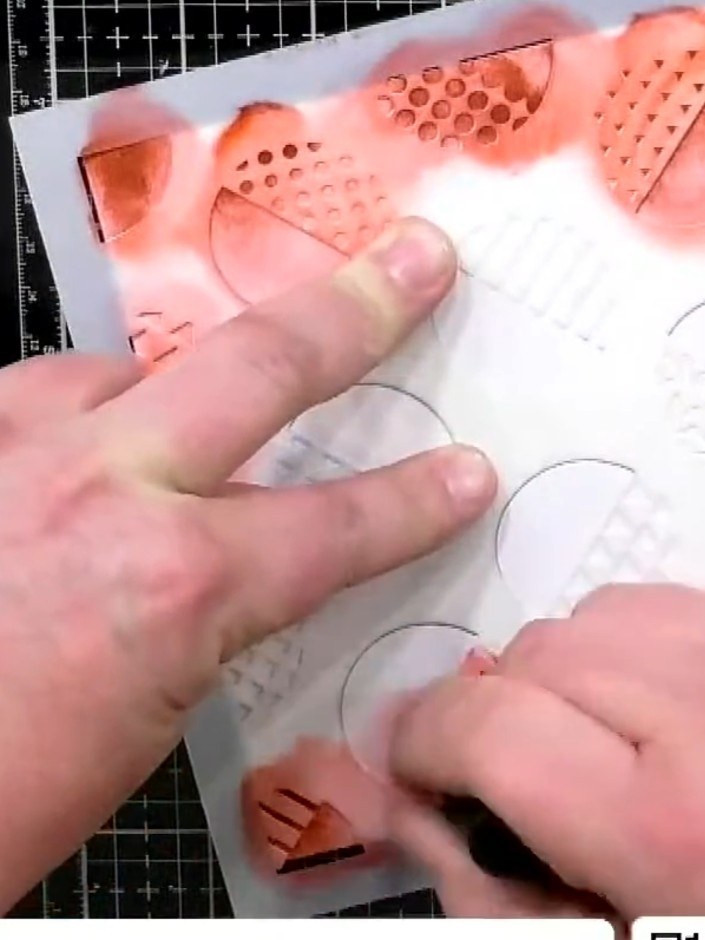 Step 3: Go back over the smaller areas with darker red ink using the Retro Dots stencil. Add more detail and depth to 
