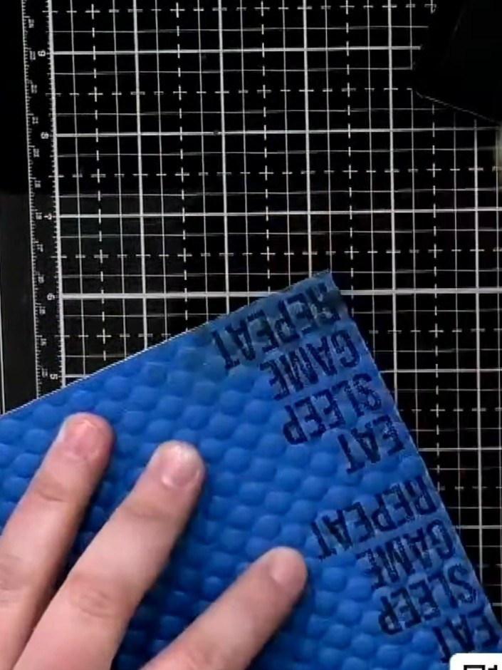 Step 8: Use a sanding block on the embossed blue panel to soften the raised areas. Work gently to break up the crisp e