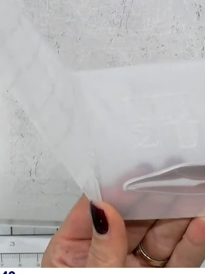 Step 8: Remove the card from the embossing folder to reveal the finished 3D embossed shoe with raised detail and spark